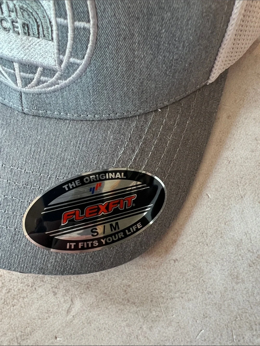 The North Face Grey & White Trucker Hat with Globe Logo Sizes S/M and L/XL